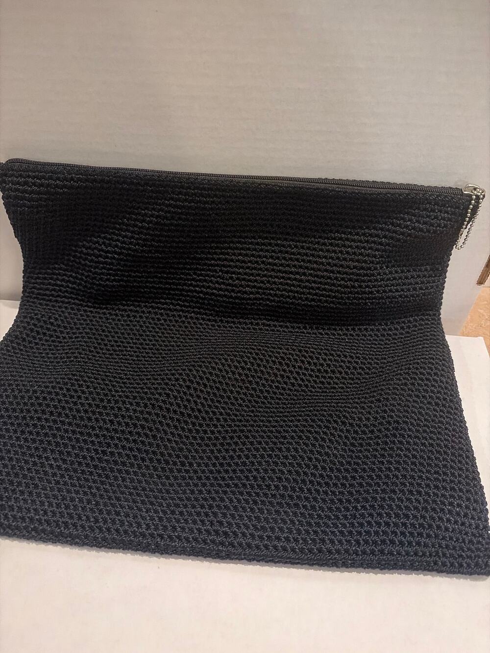 The SAK black tight-knit crochet clutch or cosmetic pouch NWOT